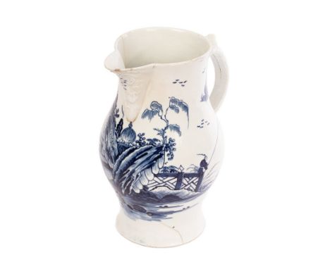 A Philip Christian, Liverpool cider jug, circa 1765, with a rococo moulded lip and delicate scroll handle, painted in blue wi