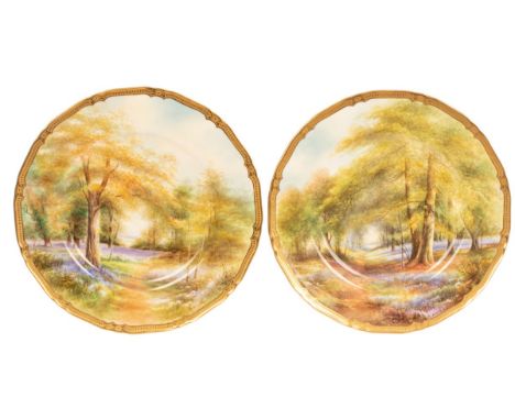A fine pair of Royal Worcester plates, by Raymond Rushton (1886-1956) dated 1940 and 1941, with acid gold rims, fully painted