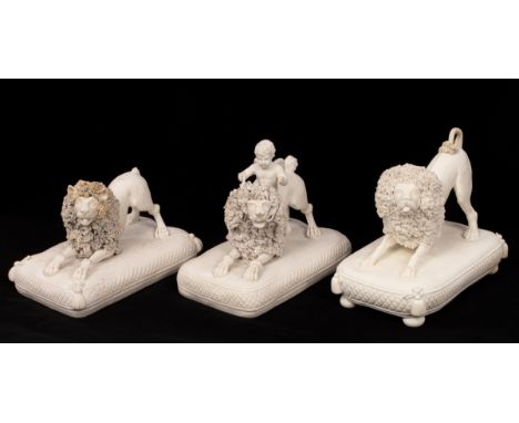 Three Worcester biscuit porcelain models of poodles, circa 1830, all 10cm long on cushion bases, one a rare model with Cupid 