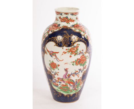 A Worcester blue scale Kakiemon vase, circa 1770, oviform and painted in red, green and blue with long tailed birds in branch