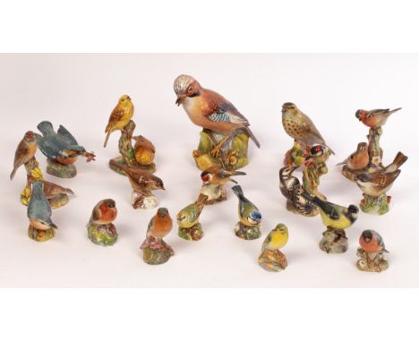 A fine collection of Royal Worcester 'glazed' small bird models, dated 1939-1956, modelled by Eva Soper, all in the sought-af