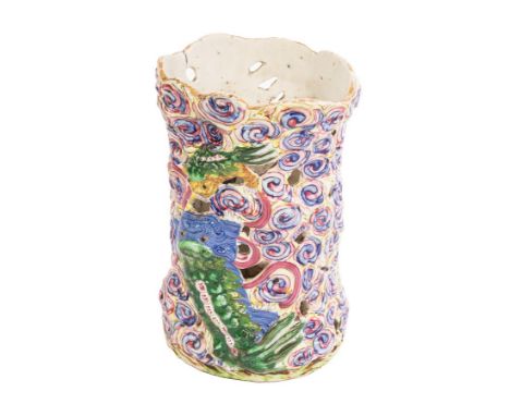 A rare Chinese porcelain joss stick holder, Jiaqing, early 19th Century, modelled in relief and pierced with kylin and cloud 