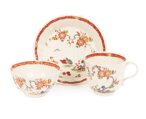 A Worcester porcelain fluted Kakiemon trio, circa 1765, blue hatched seal marks to coffee cup and saucer, comprising a tea bo
