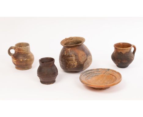 A selection of European pottery excavated items, comprising a Medieval stoneware cooking pot, 13th-14th Century, an early Ger