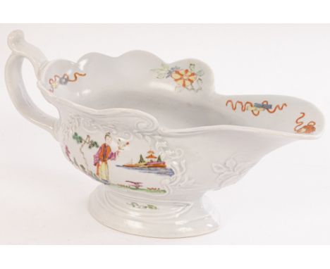 A Worcester silver-shaped footed sauce boat, circa 1753, painted Chinese figures to moulded cartouches, 19cm long CONDITION R