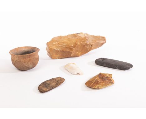 A collection of Neolithic tools, comprising a polished trapezoid axe head, probably Danish, 8.5cm, another axe head in basalt