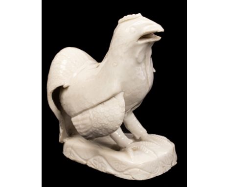 A Chinese Dehua blanc de chine model of a cockerel, Fujian, circa 1700, standing to crow, 13.7cm high/Provenance: from the He