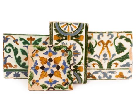 Four Spanish Maiolica Arista tiles, circa 1550-75, lightly moulded and coloured in honey brown, green, and 'Toledo blue', com