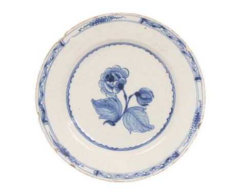 A British Delftware 'Jacobite' plate, perhaps Delftfield Pottery, Glasgow, circa 1750-60, painted in blue with a formal rose 