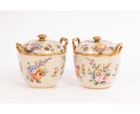 A pair of Spode oviform two-handled pot-pourri vases, pattern no. 2009, with pierced covers of white and gilt dot ground pain