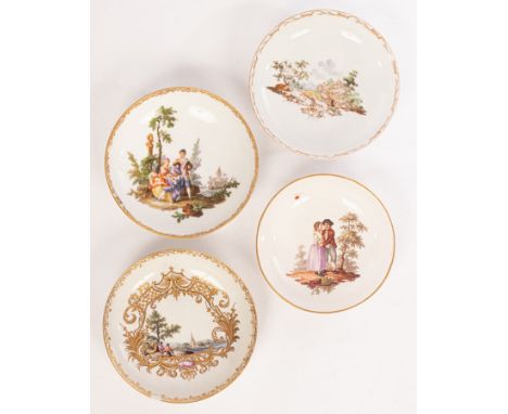 Four German saucers, 18th Century, comprising two Meissen saucers with figures and landscapes, a Ludwigsburg saucer with rust