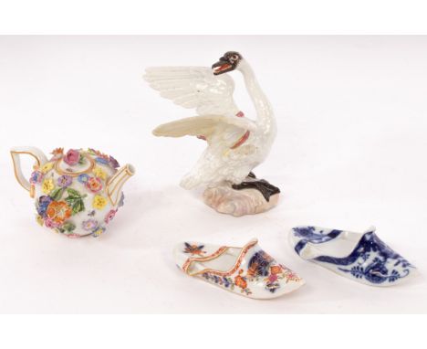 An Academic Meissen model of a swan, circa 1770, standing with wings partly outstretched, 10.5cm high, a Meissen miniature te