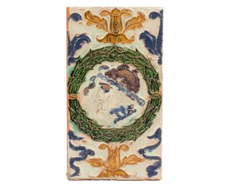 A very rare Spanish Arista ceiling tile, Seville, circa 1540-60, moulded in light relief and with coloured glazes, with a Cla