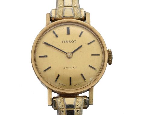 A 9ct gold Tissot Stylist manual wind wristwatch. The signed dial with baton markers, manual wind movement within a 9ct gold 