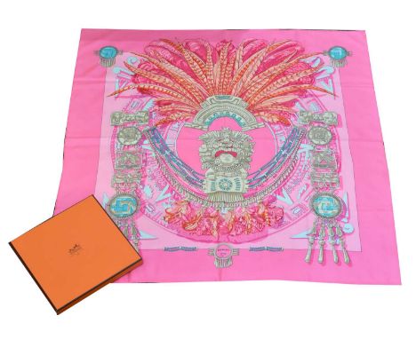 A Hermès 'Mexique' silk scarf. Designed by Cathy Latham circa 1985, the pink ground depicting Mayan motifs, 90 x 90cm, signed