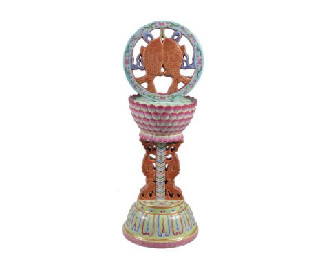  A Chinese Famille Rose Buddhist emblem altar ornament,   well modelled and enamelled in bright tones in the form of a circul