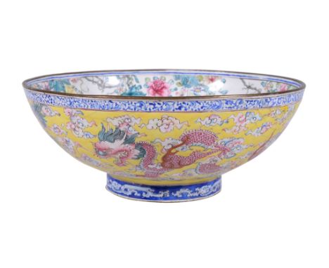  A Chinese Canton enamel 'dragon' bowl,   Qing Dynasty, Qianlong Period, the exterior painted with three dragons amongst flam