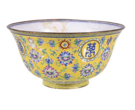  A Chinese Canton enamel bowl,   the exterior painted with   Shou   roundels on a yellow ground painted with flowers, the int