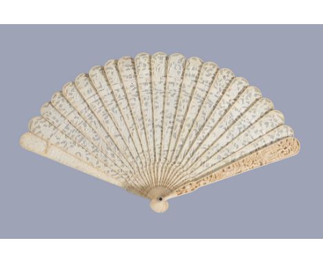 Ω A Chinese ivory brise fan, Canton, first quarter of the 19th century, carved on both sides, each pierced stick intricately 