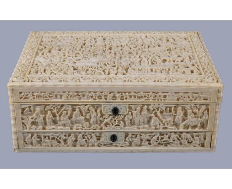 Ω A Chinese ivory sewing box, Canton, Guangdong, Qing Dynasty, circa 1850, the rectangular box finely and densely carved with