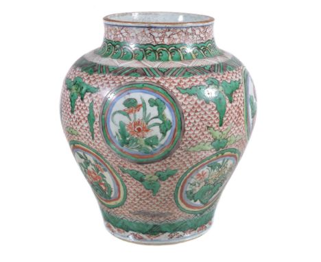  A Chinese wucai baluster vase  , Shunzhi (1644-1661), enamelled in green, lime-green, iron-red, aubergine and yellow, the sh