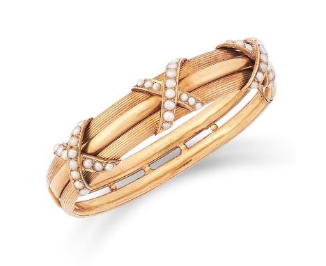 ANTIQUE PEARL BANGLE set with seed pearls in cross motif, 5.5cm inner diameter, 19.7g.