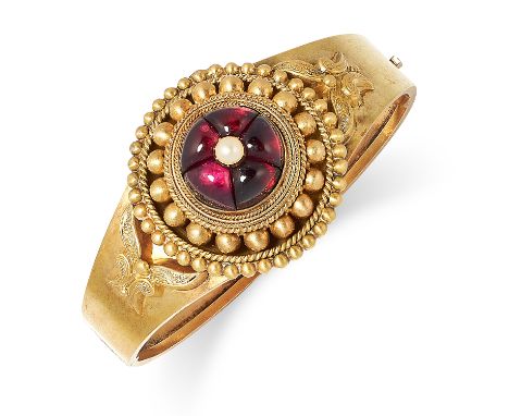 ANTIQUE VICTORIAN GARNET AND PEARL BANGLE set with cabochon garnet and a pearl, 5.5cm inner diameter, 15.4g.