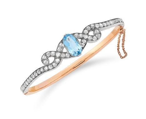 ANTIQUE AQUAMARINE AND DIAMOND BANGLE set with an oval cut aquamarine and rose cut diamonds, 6cm inner diameter, 15.2g.