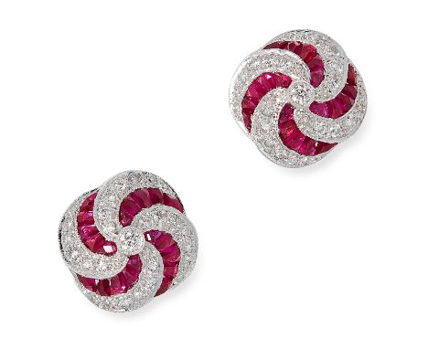 RUBY AND DIAMOND STUD EARRINGS in twisted design set with step cut rubies and round cut diamonds, 1.1cm, 5.1g.