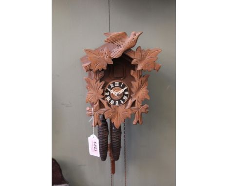 A late 20th Century wall mounted twin weight cuckoo clock, height 24cm