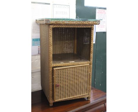 A Lloyd loom bedside cabinet