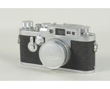 A circa 1960 Leica IIIg Rangefinder camera, NR943942, fitted with a Leitz Elmar f/2.8, 50mm lens, NR1617841 and signed lens c