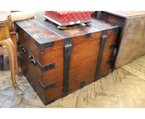 A 19th Century oak travelling trunk with iron work throughout