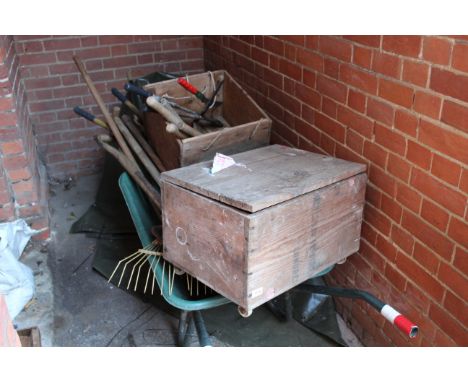 Assorted garden tools and a wheel barrow