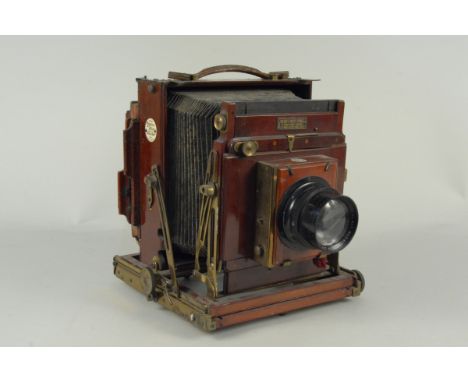 An early 20th Century mahogany and lacquered brass field camera, Thornton Pickard 'Royal Ruby' triple extension fitted with a