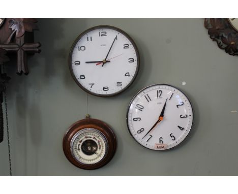 A mixed lot comprising of two various Metamec quartz wall clocks, diameter 20 1/2cm together with a small aneroid barometer