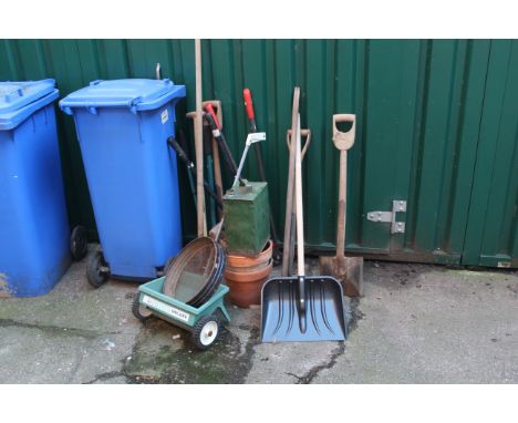 Assorted garden tools and a vintage petrol can
