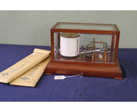 An early 20th Century mahogany cased barograph, Negretti &amp; Zambra, London, the hinged and glazed hood to a plinth base fi