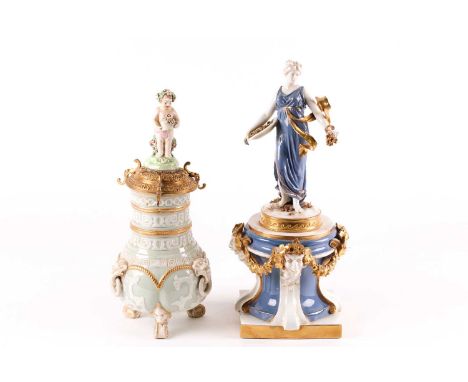 A late 19th-century continental porcelain classical figure of a classical muse with a platter of grapes in one hand. Standing