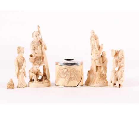 A collection of Japanese ivory okimonos, Meiji period, comprising a fisherman holding a paddle &amp; cormorant, a boy teasing