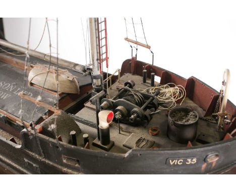 A scratch-built scale model of the 1943 victualing boat the "Clyde Puffer" (VIC 35). 104 cm long x 30 cm wide.Footnote: ‘VIC 