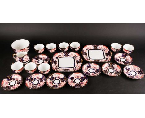 An Edwardian Royal Crown Derby Imari pattern part tea service, for nine place settings, to include a pair of bread plates, a 