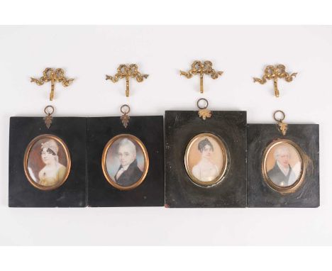 Two pairs of late 18th or early 19th century unsigned portrait miniatures, apparently on ivory, each in ebonised frame, circa