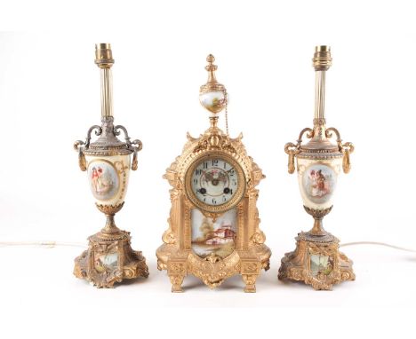 An early 20th-century gilt metal 8-day mantle clock garniture by Japy Freres &amp; Cie. The architectural body with urn finia