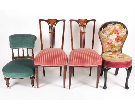 Two Victorian nursing chairs, one upholstered in a rose tapestry on ebonised cabriole legs with shell carved knee, 88cm high,