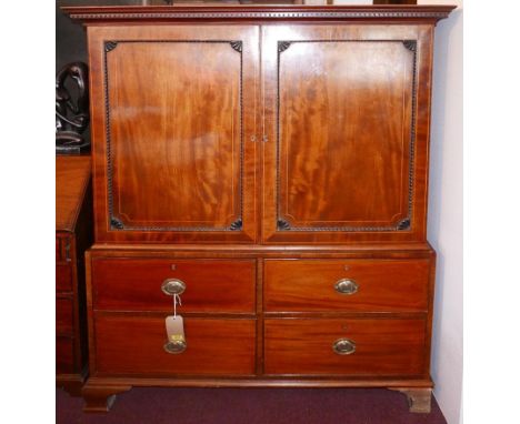 A George III inlaid mahogany linen press, two doors enclosing four trays, above four drawers, raised on bracket feet, H.164 W