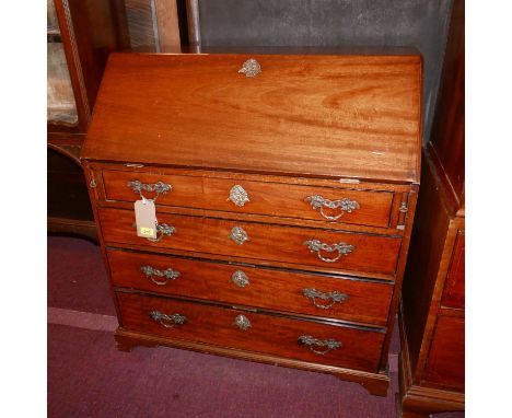 A 19th century mahogany bureau, the fitted fall front over four graduated drawers raised on bracket supports, H.100cm W.92cm 