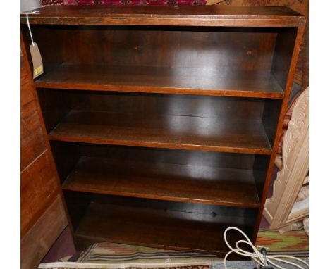 A large early 20th century oak open bookcase, raised on bracket feet, H.122 W.91 D.25cm 