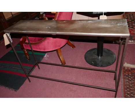 A contemporary console table, with a bronzed effect top on metal stretchered supports, H.70cm W.99cm D.25cm 