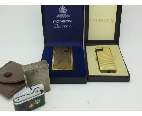 A B&amp;C Hallmarked Silver Lighter, allover engine turned; together with a Comoy's lighter, a Crown lighter, and a Ronson el
